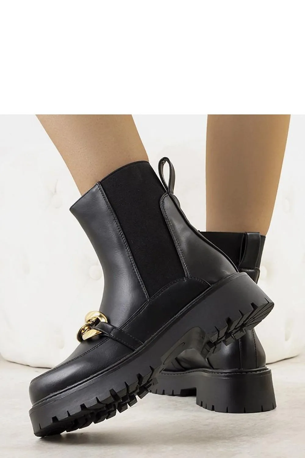 Black ankle boots with a high sole